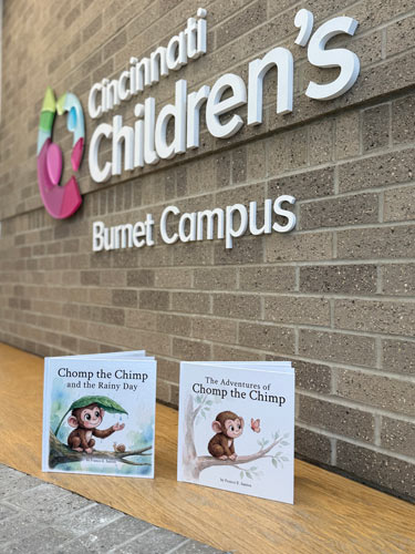 Picture showing the first two books of The Adventures of Chomp the Chimp at Cincinnati Children's Hospital